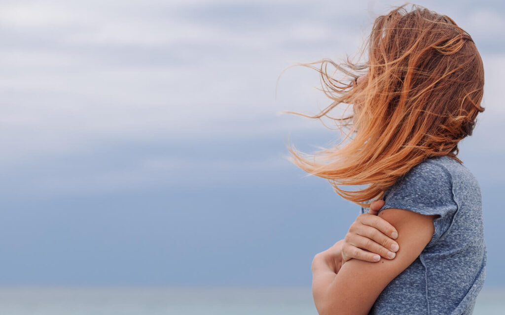 A woman contemplates getting Benzodiazepine Addiction treatment.