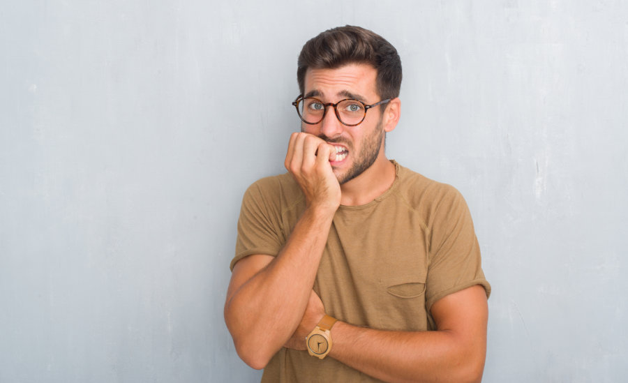 Xanax Abuse and Addiction bigstock Handsome young man over grey g 254653936 900x549 1